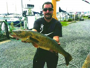 Craig Provost with the 30-inch walleye that netted him more than $13,000. 