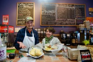The folks at Java Baba's Slow Food Cafe dish out sandwiches and smiles. Photo by Donald Dill.